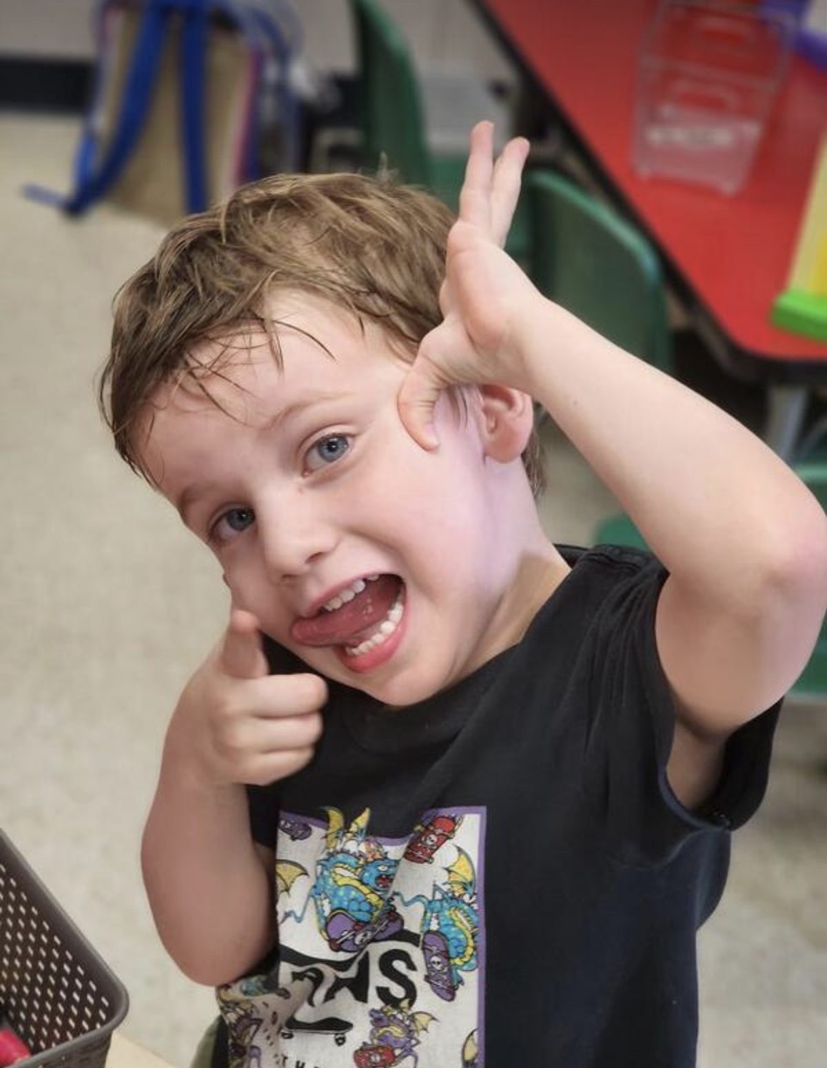 Thumbs up from a happy Early Learning Center kid